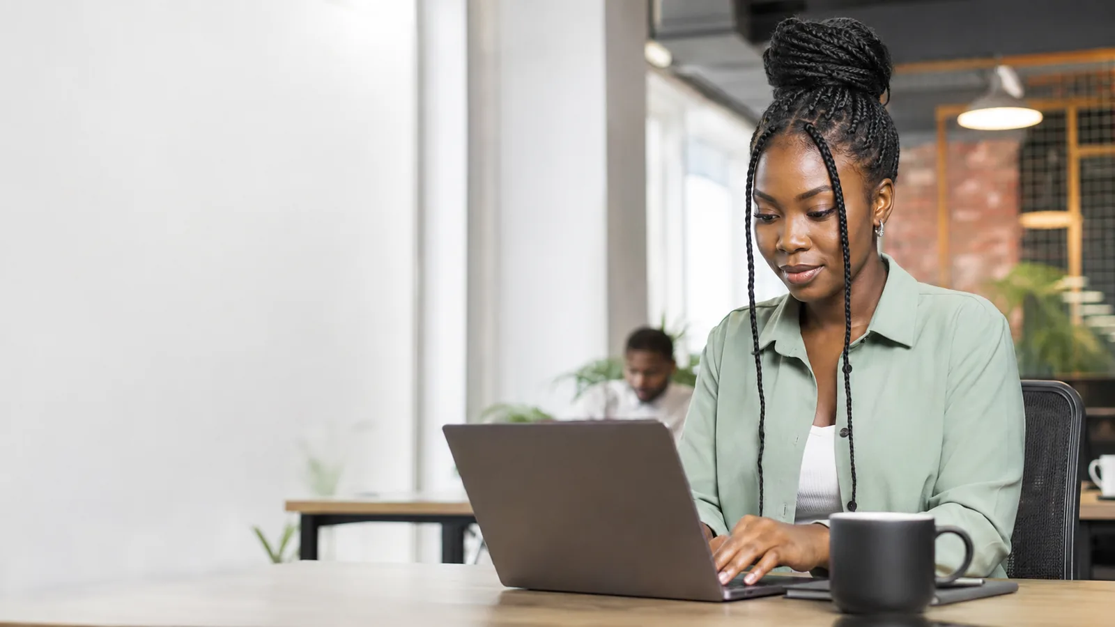 Nigerian learner studying practical skills on a laptop